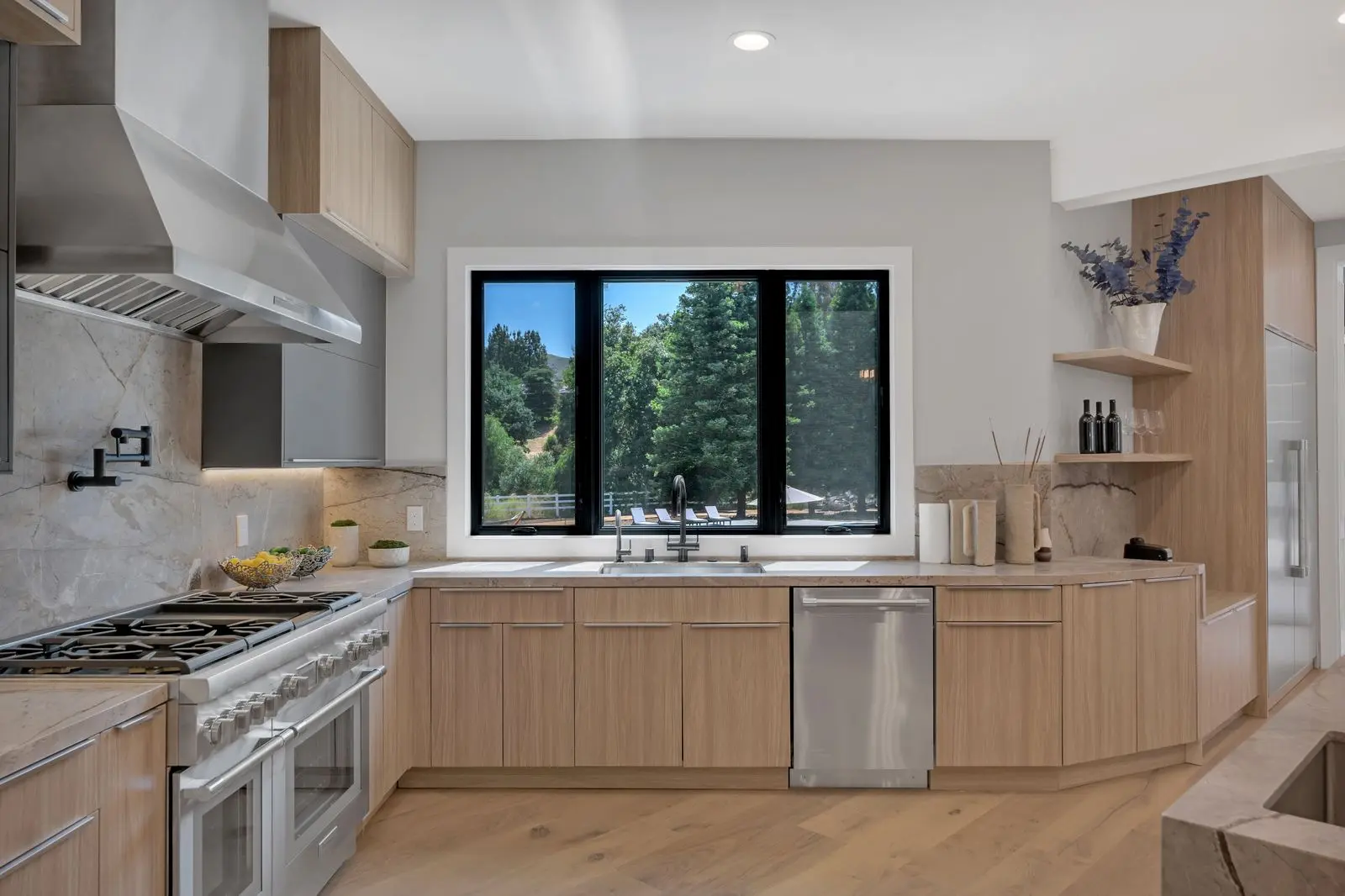 Modern kitchen remodeling project by WW Builders in Silicon Valley California featuring custom cabinetry and large windows
