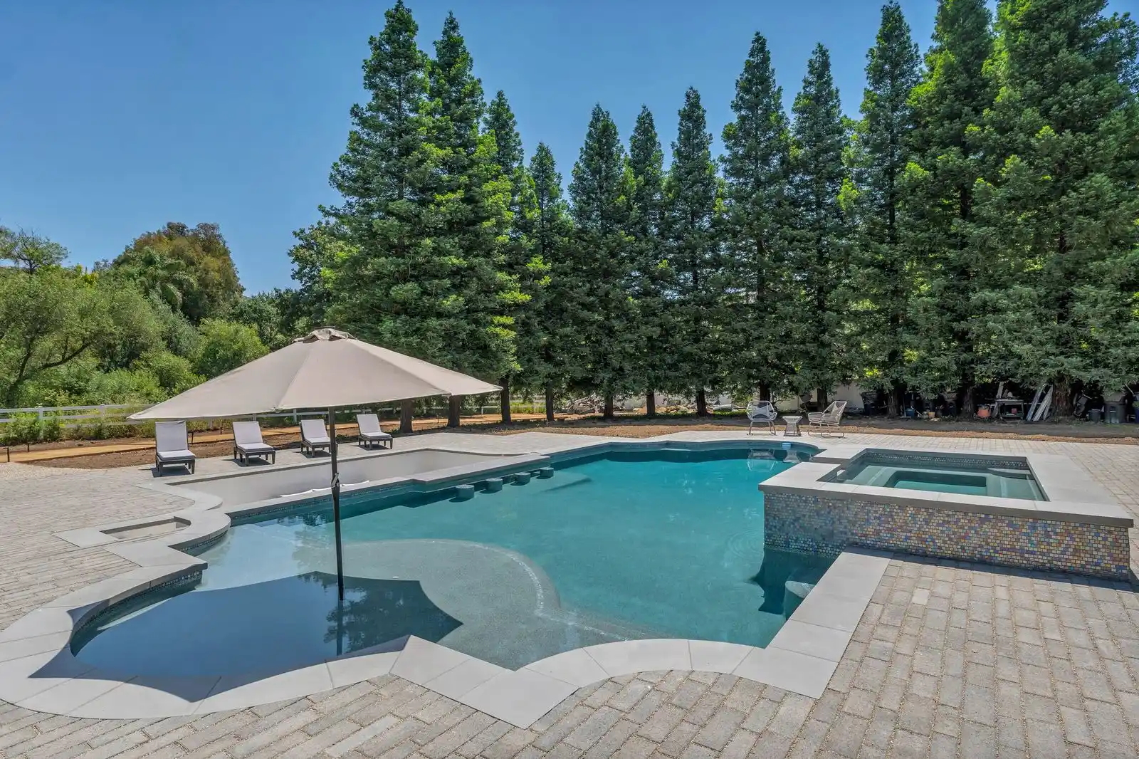 Luxury pool and outdoor living remodeling project by WW Builders in Los Altos, California