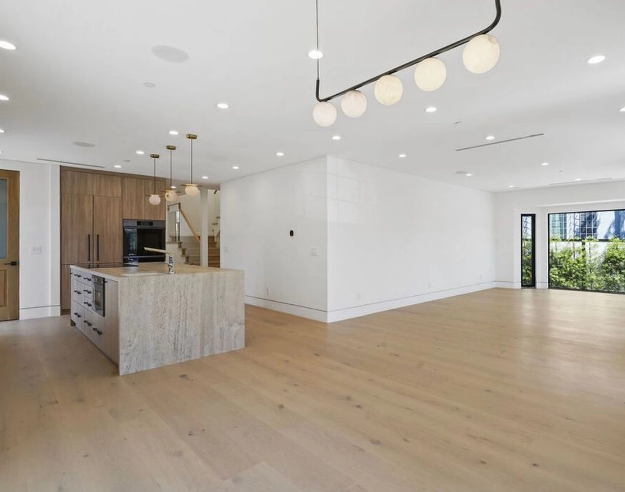 Open concept living room remodeling project by WW Builders in San Jose, California featuring modern finishes
