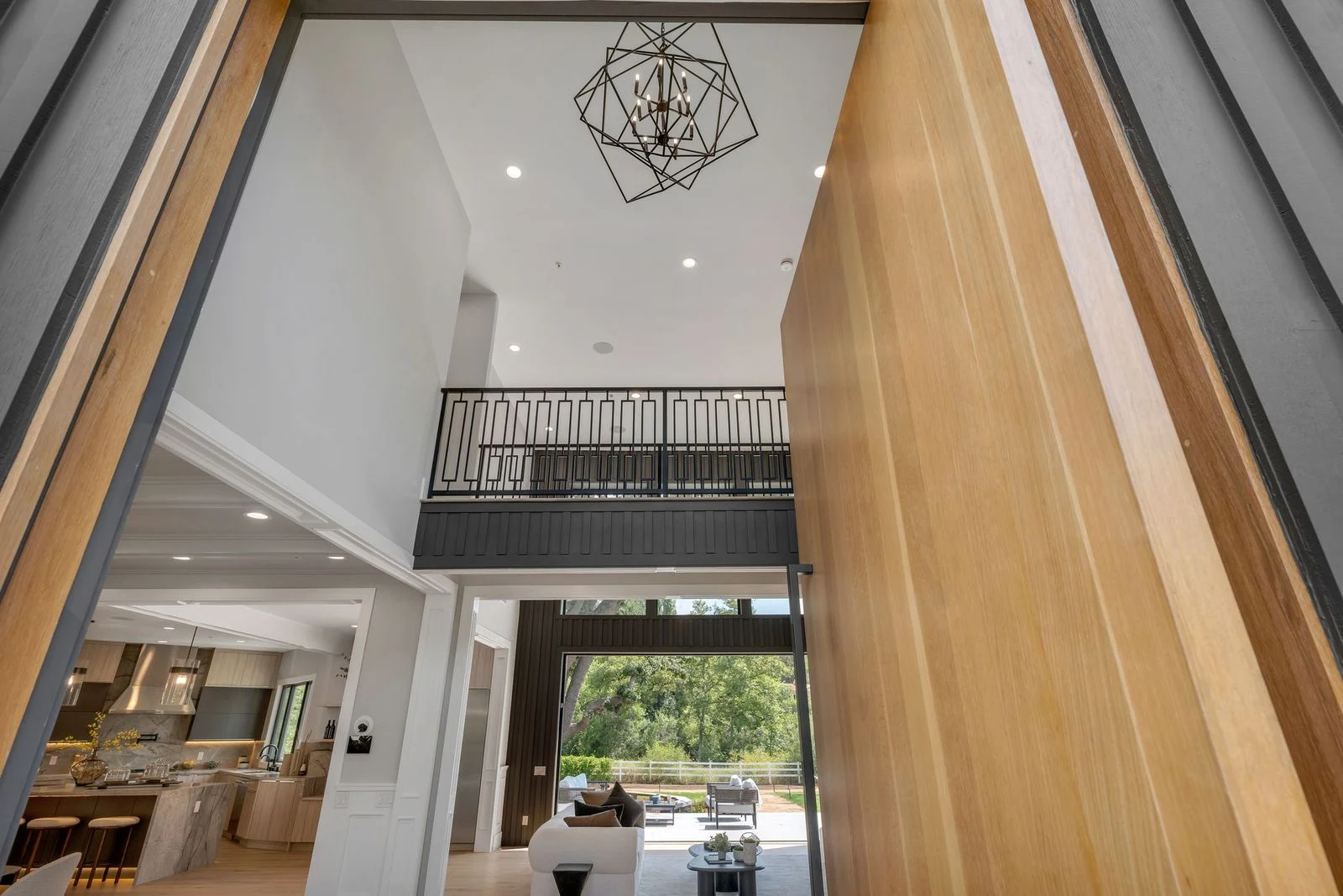 Modern entryway remodeling project by WW Builders in Silicon Valley, California featuring custom wood finishes and open foyer design